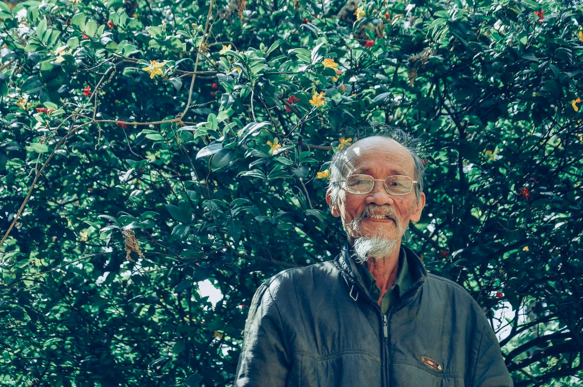 An older man smiling confidently outdoors, the age group most often weighing full-arch dental implants in Malaysia.