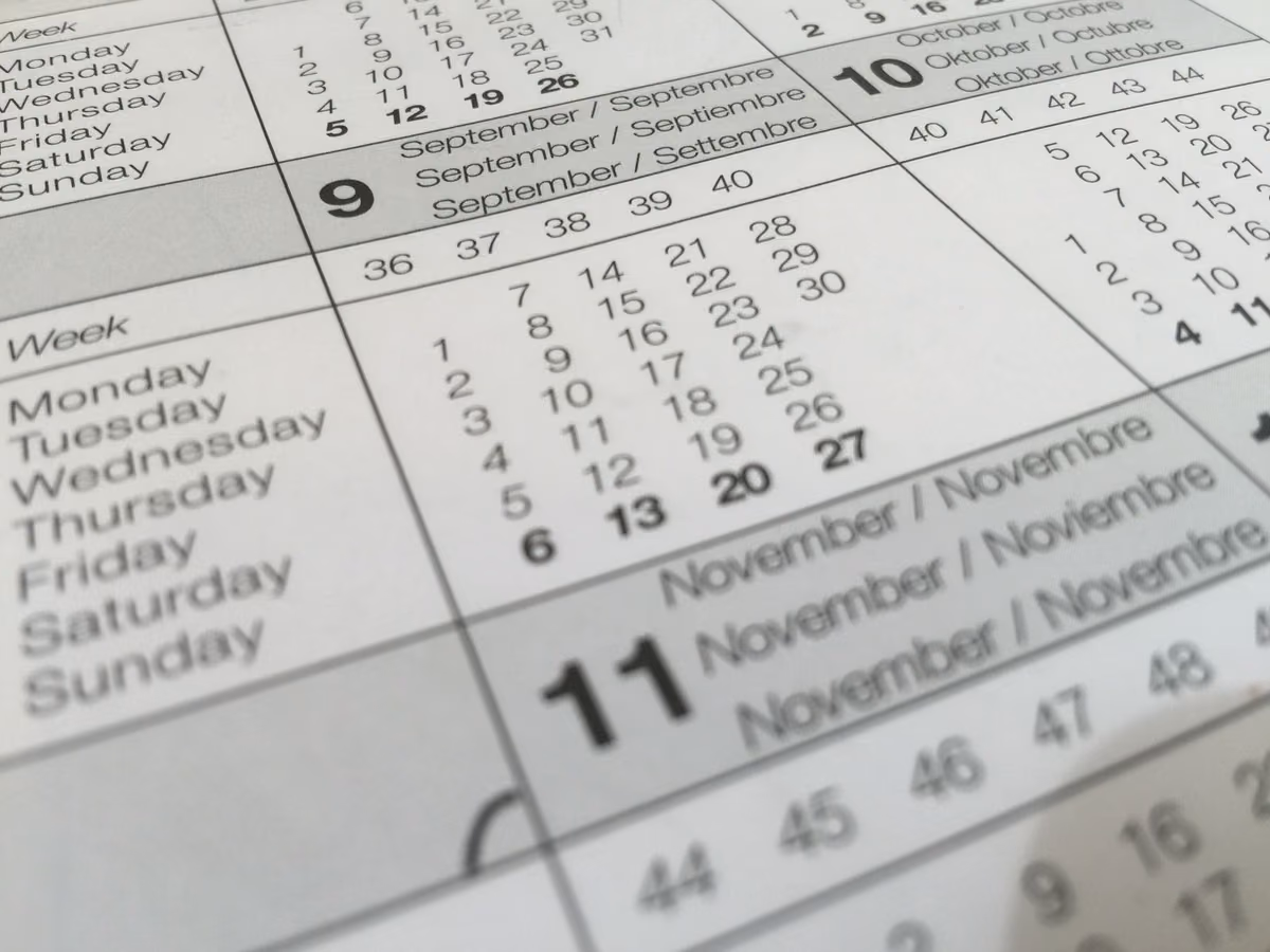 A calendar showing several months at once, representing the three to nine month wait between a bone graft and implant placement.