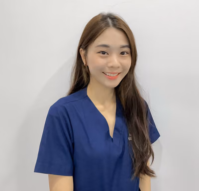 Dr. Chew Yuen Huan, a gentle and friendly resident dental surgeon at Lau Dental Clinic Sri Petaling, smiling warmly